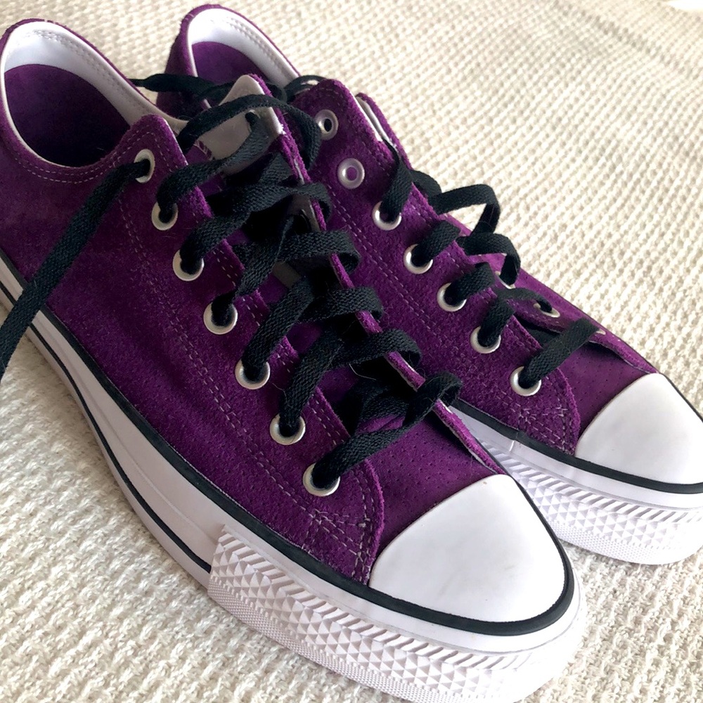Purple suede Chuck Taylor Pros.